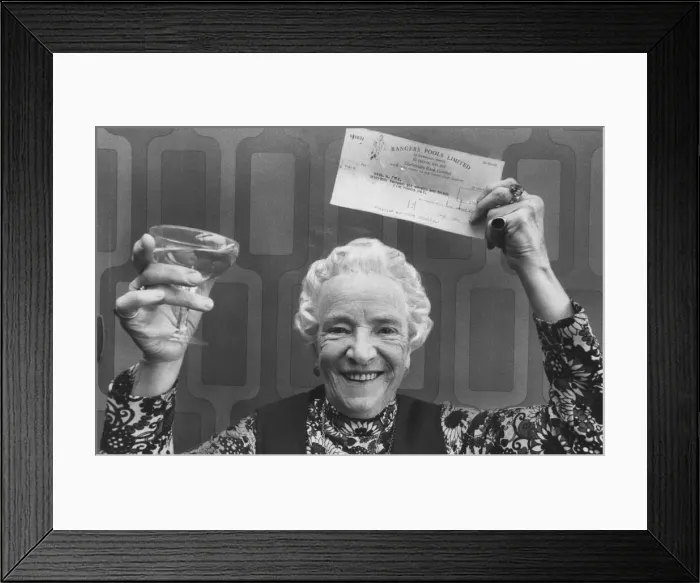 Framed Print : May Fyfe celebrates a pools win with a glass of champers, October 1976 Framed Print : May Fyfe celebrates a pools win with a glass of champers, October 1976