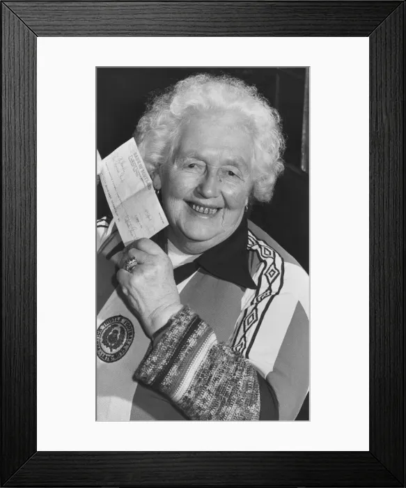 Framed Print : Margaret Cameron, 85, holds up her cheque for !000 after winning the first draw in Framed Print : Margaret Cameron, 85, holds up her cheque for !000 after winning the first draw in