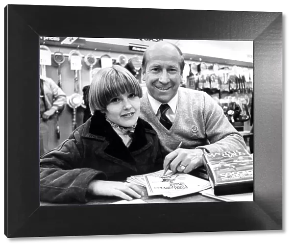 Bobby Charlton signing autographs in Binns, Newcastle in December 1982