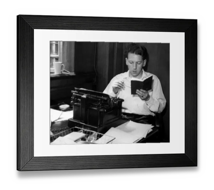 Framed Print : Keith Waterhouse Daily Mirror columnist July 1957 Sitting at typewriter reading Framed Print : Keith Waterhouse Daily Mirror columnist July 1957 Sitting at typewriter reading