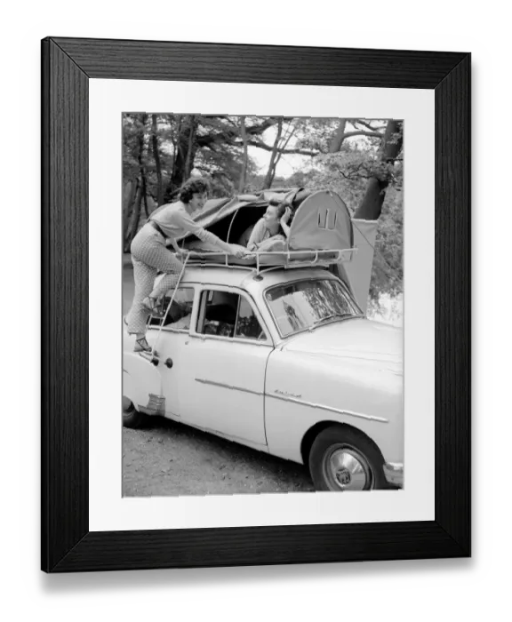 Framed Print : Two reveille models seen here demonstrating the new car rack tent Framed Print : Two reveille models seen here demonstrating the new car rack tent