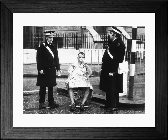 Framed Print : Runner in the London Marathon March 1981 being helped by members of the St Framed Print : Runner in the London Marathon March 1981 being helped by members of the St