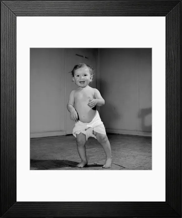 Framed Print : A 14 month baby toddles about the Baby Clinic before going in to the doctors surgery Framed Print : A 14 month baby toddles about the Baby Clinic before going in to the doctors surgery