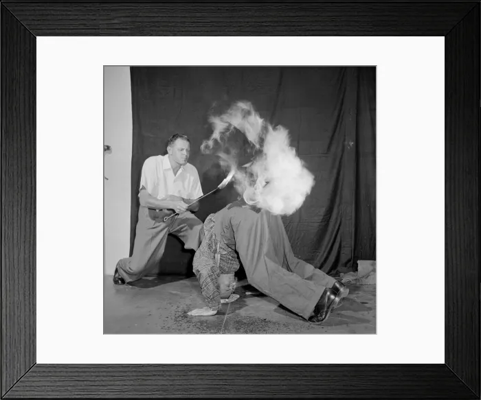Framed Print : In The Hot Seat Frank Batson fries an egg on the backside of Neville Wood to Framed Print : In The Hot Seat Frank Batson fries an egg on the backside of Neville Wood to