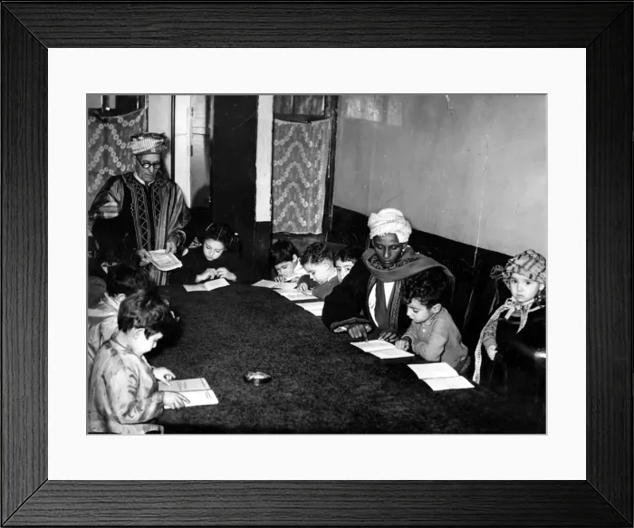 Framed Print : In a small room a group of children are learning the alphabet of Arabia with the Koran as Framed Print : In a small room a group of children are learning the alphabet of Arabia with the Koran as