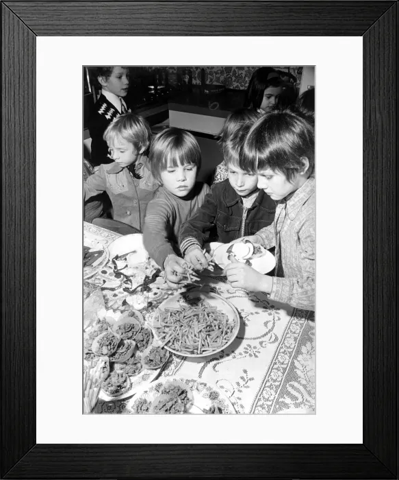 Framed Print : Childrens birthday party Nicky eating on his 6th birthday March 1975 Framed Print : Childrens birthday party Nicky eating on his 6th birthday March 1975