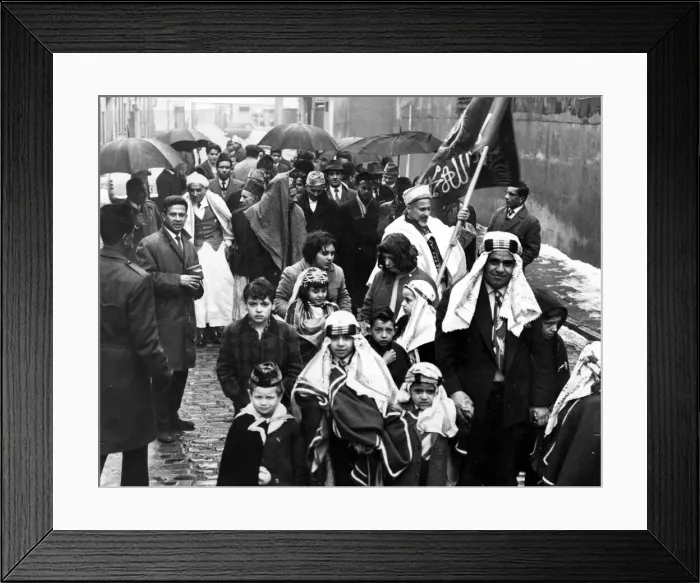 Framed Print : Moslems form a procession in Gladstone Street before marching down Bute Street to Framed Print : Moslems form a procession in Gladstone Street before marching down Bute Street to