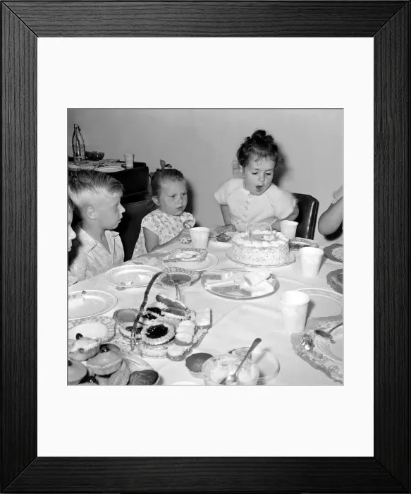 Framed Print : Eve Black celebrating her 4th Birthday Party with friends - Blowing out Framed Print : Eve Black celebrating her 4th Birthday Party with friends - Blowing out
