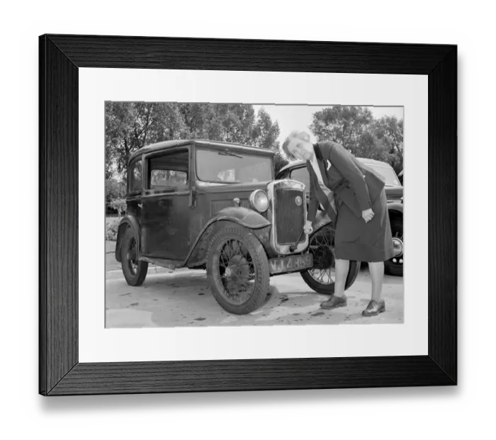 Framed Print : Mrs Goul tries to start her car with the starting handle Circa 1957 Framed Print : Mrs Goul tries to start her car with the starting handle Circa 1957