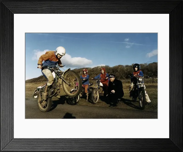 Framed Print : Policeman Ewan Skinner with some of the kids on the Rural