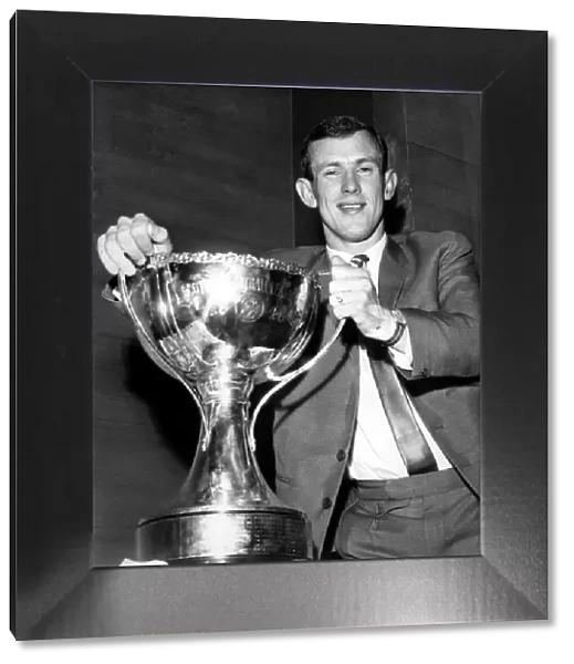 I won it-I hold it! Bobby Lennox triumphantly grasps the Cup he won with that 19th minute