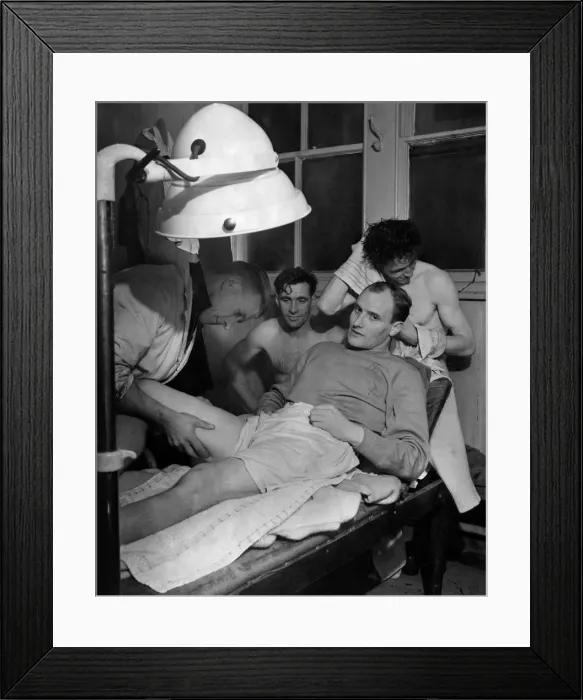 Framed Print : Jack Meaney, Crewe Alexandras left half-back, has a spot of pre-Cup-tie electric Framed Print : Jack Meaney, Crewe Alexandras left half-back, has a spot of pre-Cup-tie electric