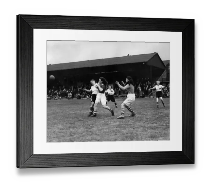 Framed Print : Ladies Association Football. England v. Scotland. A Scottish defender makes a vigorous