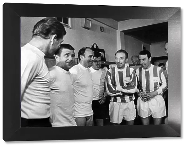 Sir Stanley in the dressing room with his international friends around him