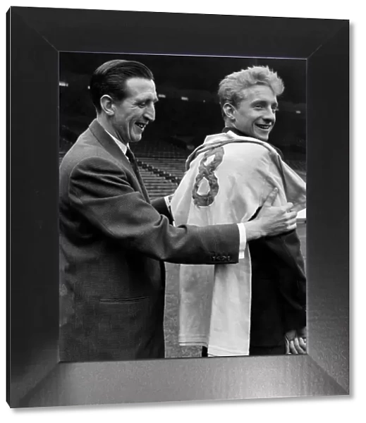 Denis Law meets his new jersey and the Capt of Manchester City team Ken Barnes
