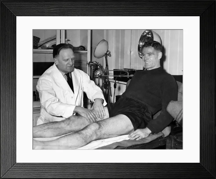 Framed Print : Billy Liddell, gets a massage from Albert Shelley, trainer, after his morning training Framed Print : Billy Liddell, gets a massage from Albert Shelley, trainer, after his morning training