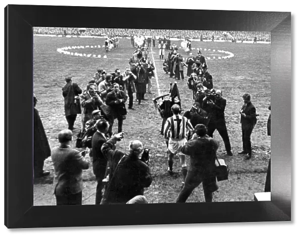 Sir Stanley being piped onto the field. April 1965 P011228