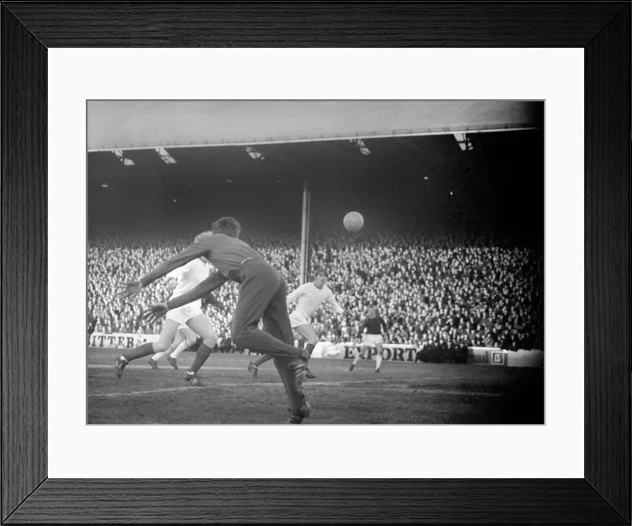 Framed Print : Sport. Football: Burnley v. Man United. Ure - Un. Centre half heads clear from a canasas Framed Print : Sport. Football: Burnley v. Man United. Ure - Un. Centre half heads clear from a canasas