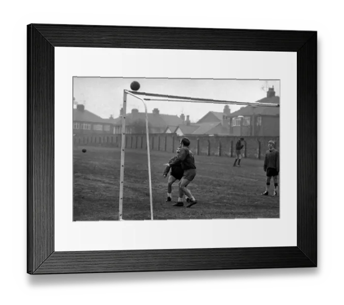 Framed Print : Bobby Graham, Evans and Ross who was acting as goalkeeper during a spot of training Framed Print : Bobby Graham, Evans and Ross who was acting as goalkeeper during a spot of training