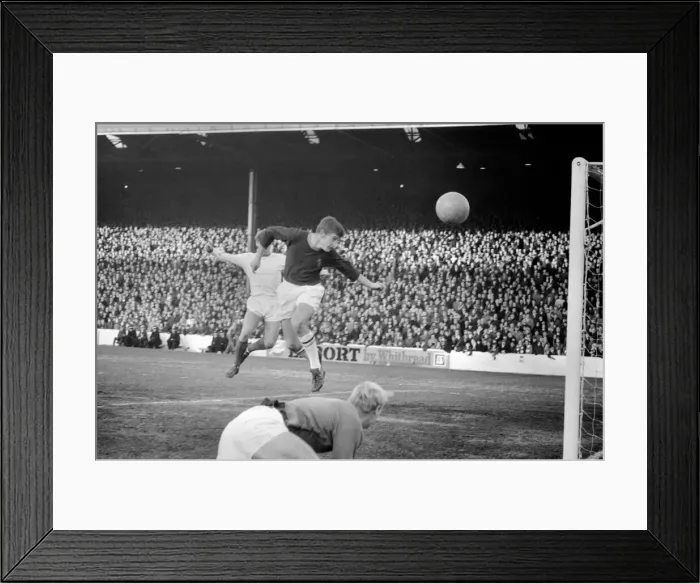 Framed Print : Sport. Football: Burnley v. Man United. Burnkey full back / heads clear for a corner after Framed Print : Sport. Football: Burnley v. Man United. Burnkey full back / heads clear for a corner after