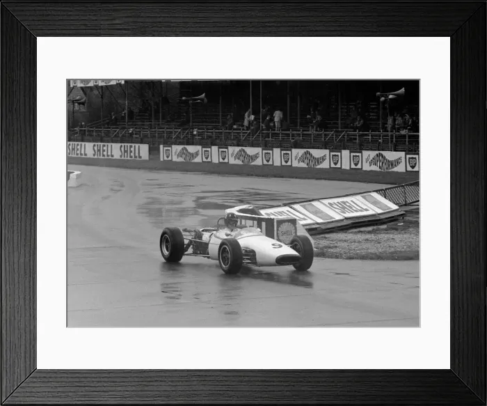 Framed Print : Graham Hill in action on the practice day for the Sunday Mirror Trophy April 1960 Framed Print : Graham Hill in action on the practice day for the Sunday Mirror Trophy April 1960