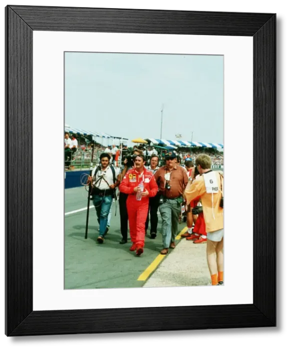 Framed Print : Nigel Mansell Motor Racing Driver Formula One F1 walks from the Silverstone Track after Framed Print : Nigel Mansell Motor Racing Driver Formula One F1 walks from the Silverstone Track after