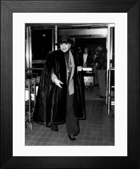 Framed Print : Joan Collins Actress at Heathrow Airport