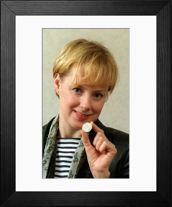 : Sally Whittaker and May 1998 Coronation Street actress holding an old 50p : Sally Whittaker and May 1998 Coronation Street actress holding an old 50p