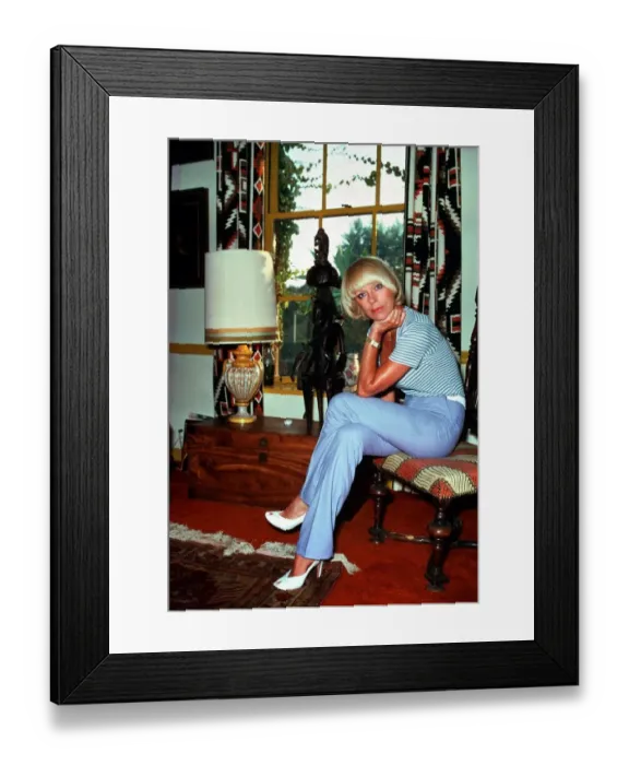 Framed Print : Elke Sommer, actress inside a house sitting on a chair sex icon