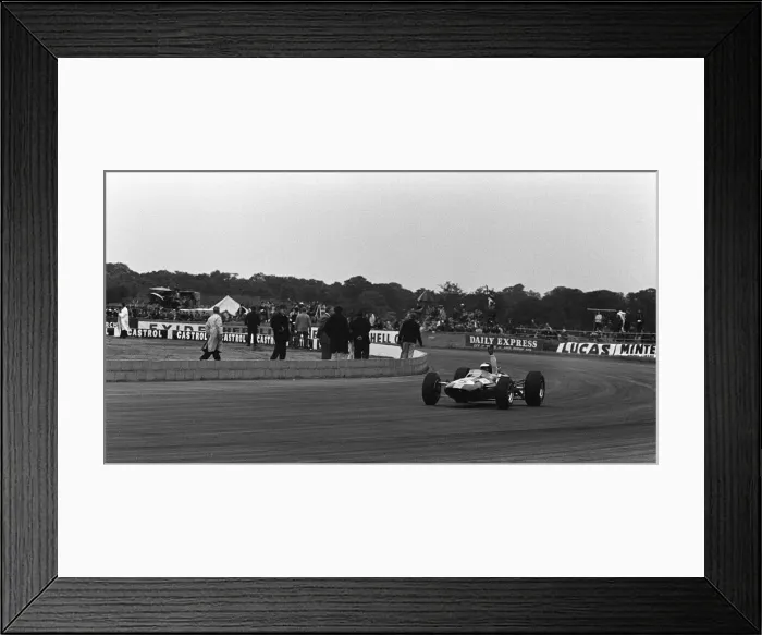 Framed Print : Jim Clark waves as he wins the British Grand Prix at Silverstone in 1965 in his Lotus Framed Print : Jim Clark waves as he wins the British Grand Prix at Silverstone in 1965 in his Lotus