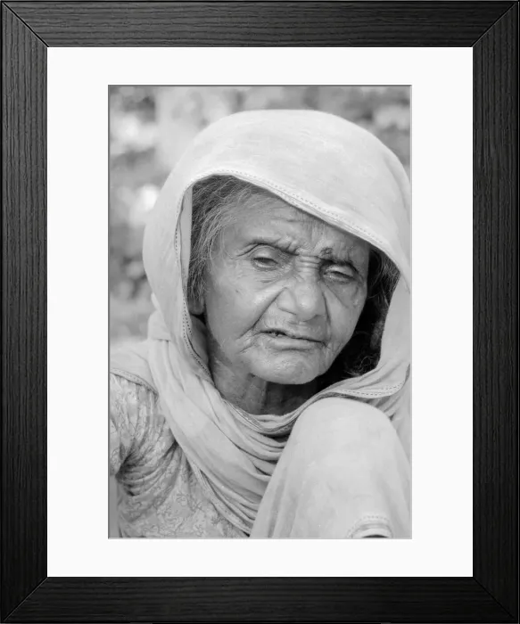 Framed Print : Cataracs dim the eyes of the old flower seller who sits at the enterance of Gandi Framed Print : Cataracs dim the eyes of the old flower seller who sits at the enterance of Gandi