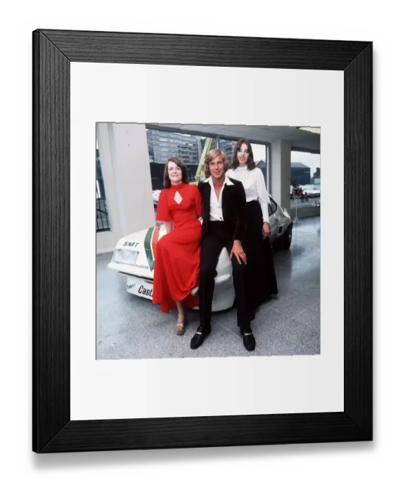 Framed Print : James Hunt racing driver May 1976 sitting on bonnet of rally car with female fans