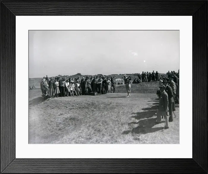 Framed Print : Spectatotrs watch a competitor tee off during the 1949 British Open at Royal St
