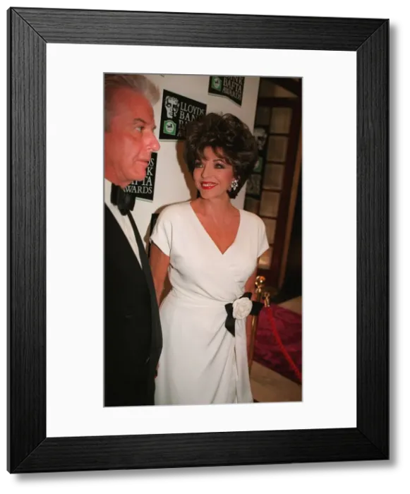 Framed Print : Joan Collins arriving BAFTA Awards 1996 accompanied by man wearing bow tie