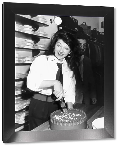 Pop singer Kate Bush cuts her 30th birthday cake at Blazers Boutique where she was