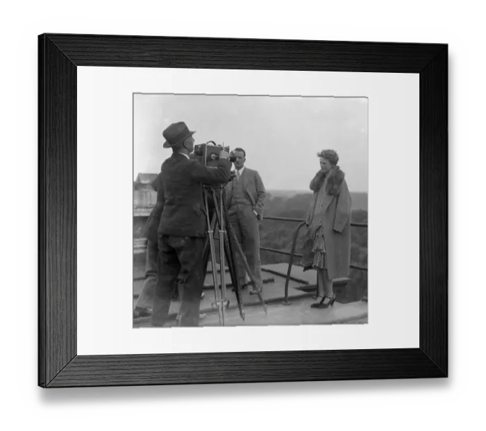 Framed Print : Woman pilot Amelia Earhart poses for the news cine camera on the roof of the Dorchester Framed Print : Woman pilot Amelia Earhart poses for the news cine camera on the roof of the Dorchester
