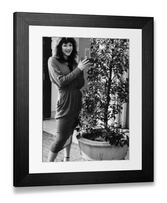 Framed Print : Pop singer Kate Bush with her Melody Maker Pop Award for Top Female Singer Framed Print : Pop singer Kate Bush with her Melody Maker Pop Award for Top Female Singer