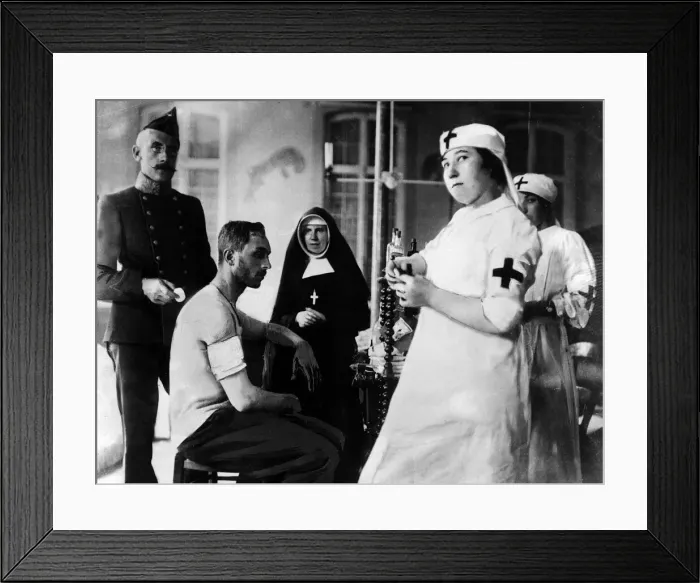 Framed Print : Red Cross nurses and doctors with wounded men during World War I Circa 1916 Framed Print : Red Cross nurses and doctors with wounded men during World War I Circa 1916
