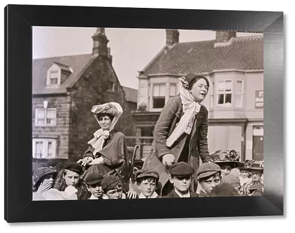 Suffragette Emmeline Pankhurst seated as Margaret Bondfield makes a speech Circa