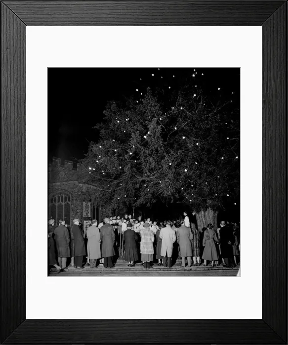 Framed Print : The vicar of Martins Church in Herne conducts a carol service under a christmas tree in