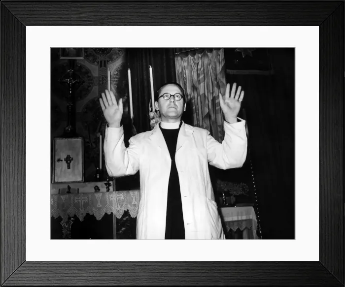 Framed Print : Father Harold Nicholson September 1948 In a bombed church in Sloane Square