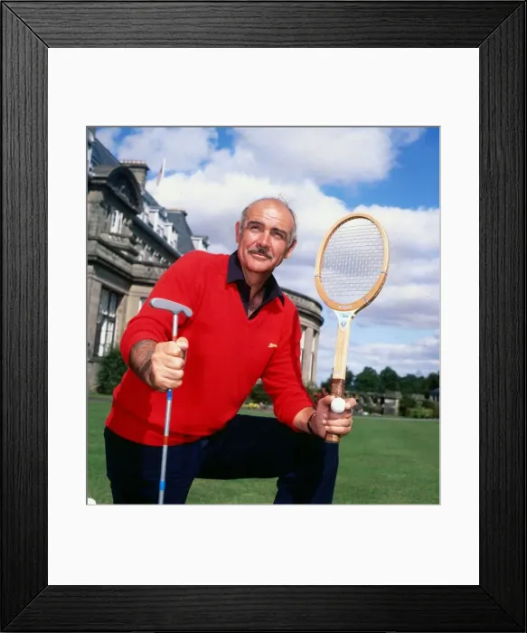 Framed Print : Sean Connery holding tennis raquet and golf club August 1981