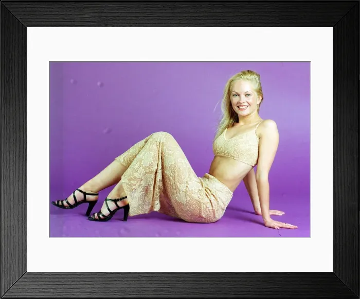 Framed Print : NIKKI MOFFAT JULY 1997 WEARING GOLD LACE TOP AND SKIRT SITTING ON FLOOR