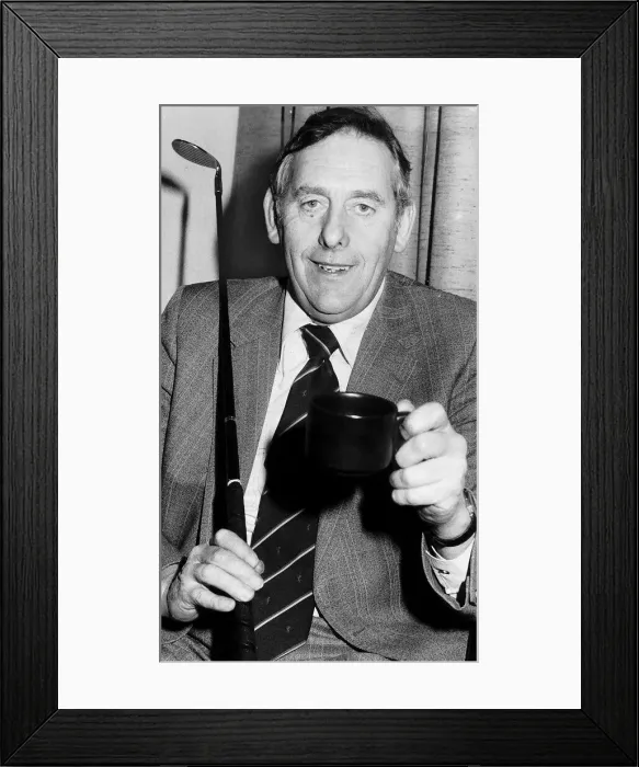Framed Print : Charlie Green sitting holding up mug with golf club resting on shoulder