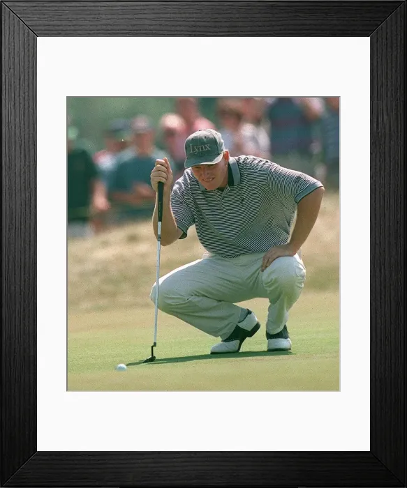 Framed Print : Ernie Els lines up a putt at Lytham golf open wearing Lynx skip cap kneeling Framed Print : Ernie Els lines up a putt at Lytham golf open wearing Lynx skip cap kneeling