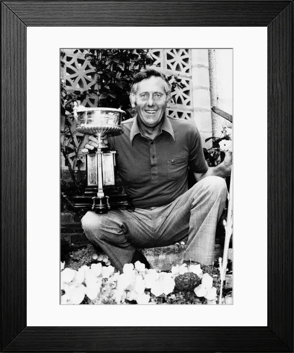 Framed Print : Charlie Green kneeling in garden holding lawn trimmers in one hand