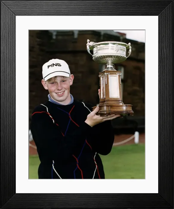 Framed Print : Stephen Gallacher of Bathgate standing holding up the trophy he has won in the Amatuer Framed Print : Stephen Gallacher of Bathgate standing holding up the trophy he has won in the Amatuer