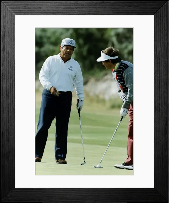 Framed Print : American golfer Lee Trevino talking to another player who is about to take putt Framed Print : American golfer Lee Trevino talking to another player who is about to take putt