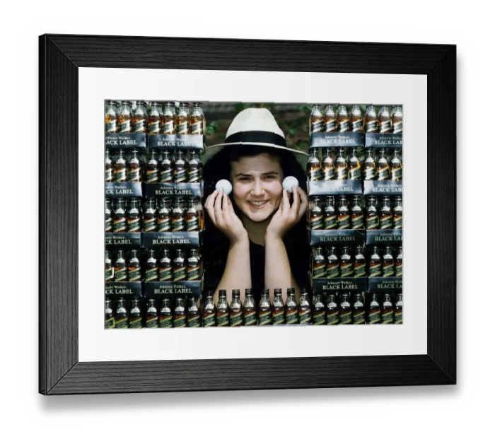 Framed Print : Lisa Santangeli JGT marketing holding golf balls miniatures of Johnie Walker Black Label