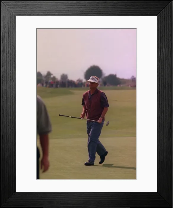 Framed Print : Sandy Lyle golfer on green carrying putter wearing skip cap at Gleneagles golf course
